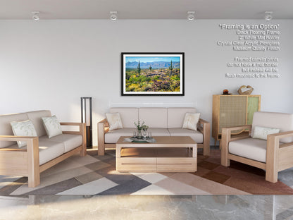 a modern living room with a large framed landscape painting hanging on the wall. The room is furnished with a sofa, two armchairs, and a coffee table, creating a comfortable and inviting atmosphere.