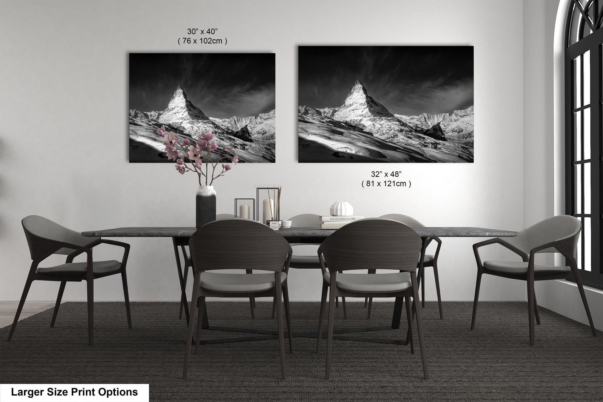 a black and white photo of a dining room table